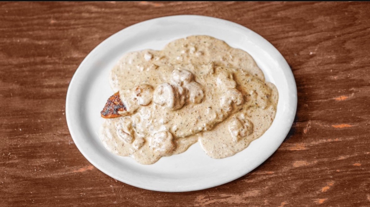 Blackened chicken smothered in a creamy mushroom sauce