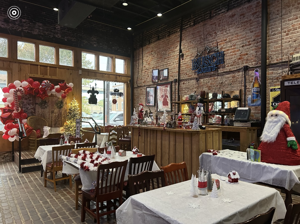 The bar at Cecil's with big TVs visible above